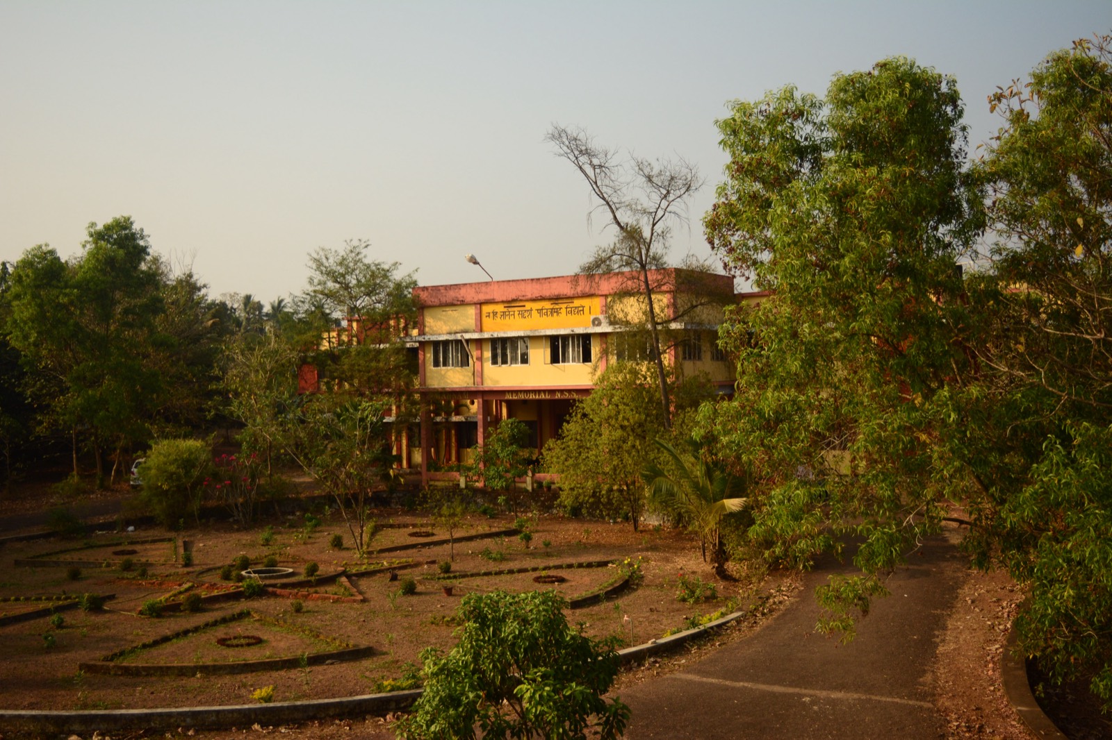 The main college building, bearing the college motto.